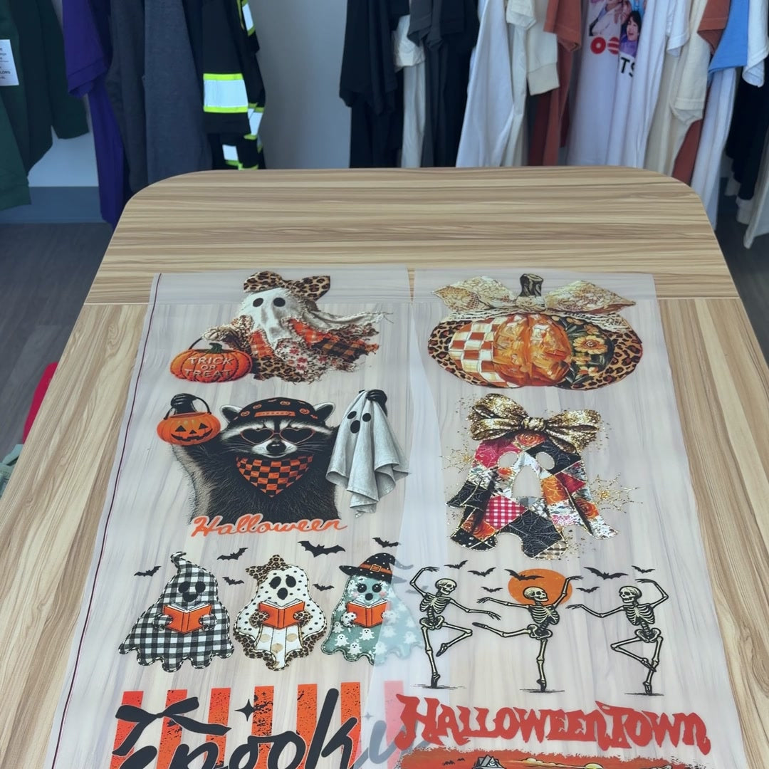 A real 22-inch DTF gang sheet laid out with ten designs, printed in-house at Print Press Co in Hoffman Estates