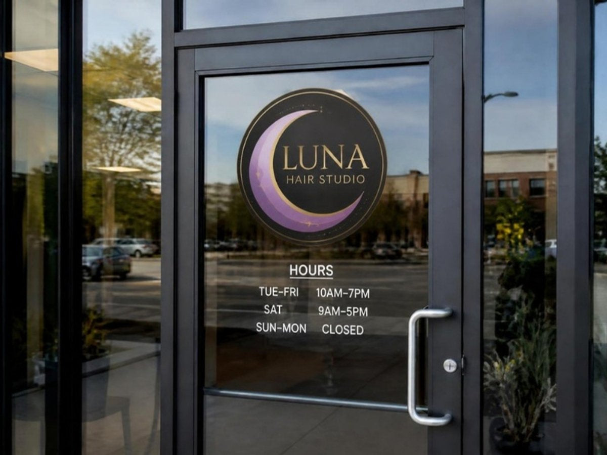 Full-color logo decal plus store hours decal on a glass storefront door