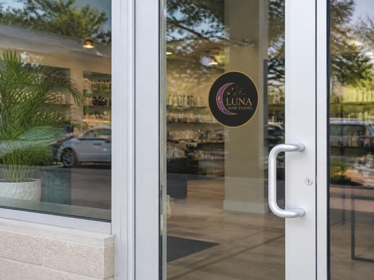 Small full-color logo decal on a glass door