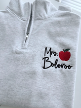 Quarter-zip sweatshirt embroidered with teacher name and apple