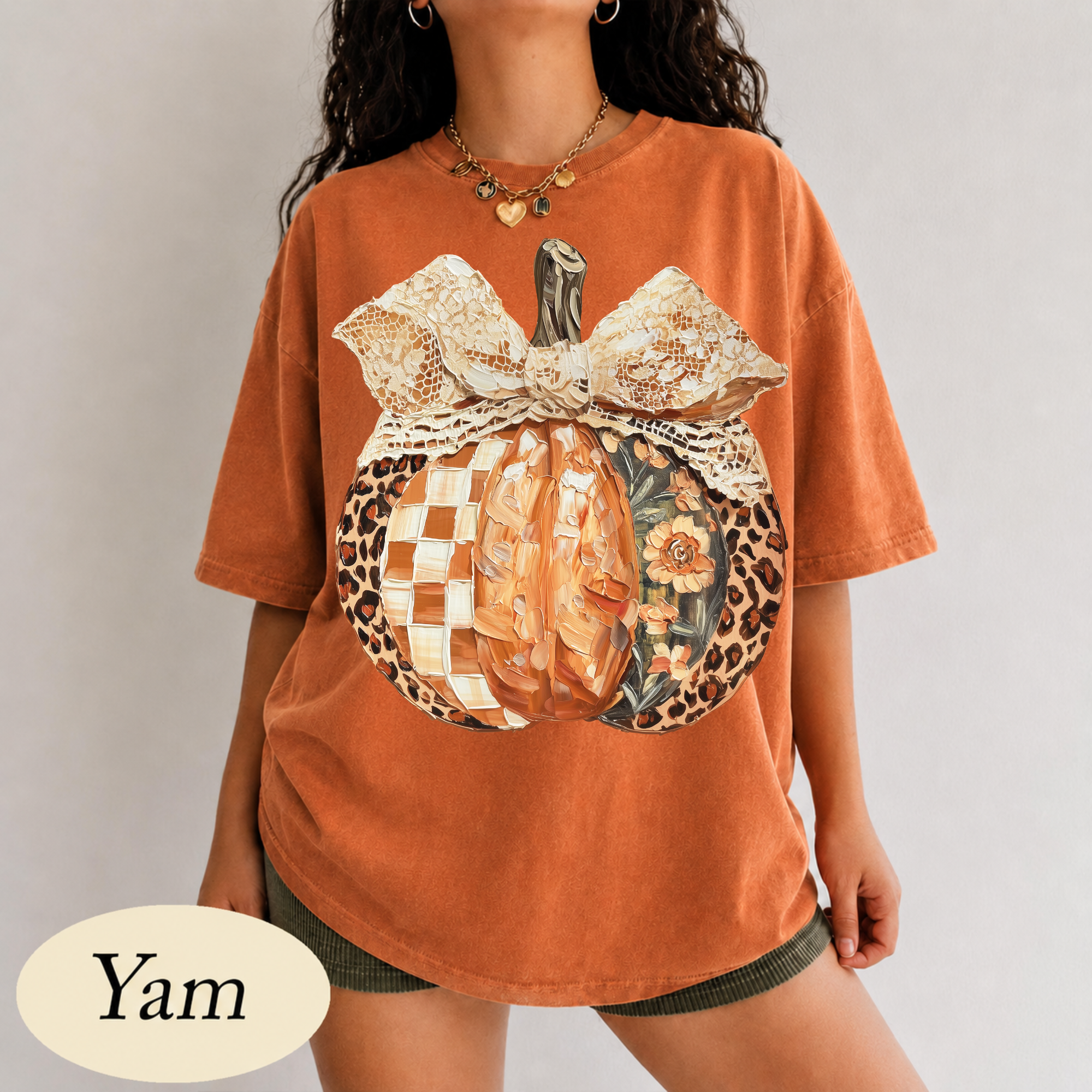 Leopard and checkered patchwork pumpkin with lace bow DTF transfer on yam orange Comfort Colors t-shirt