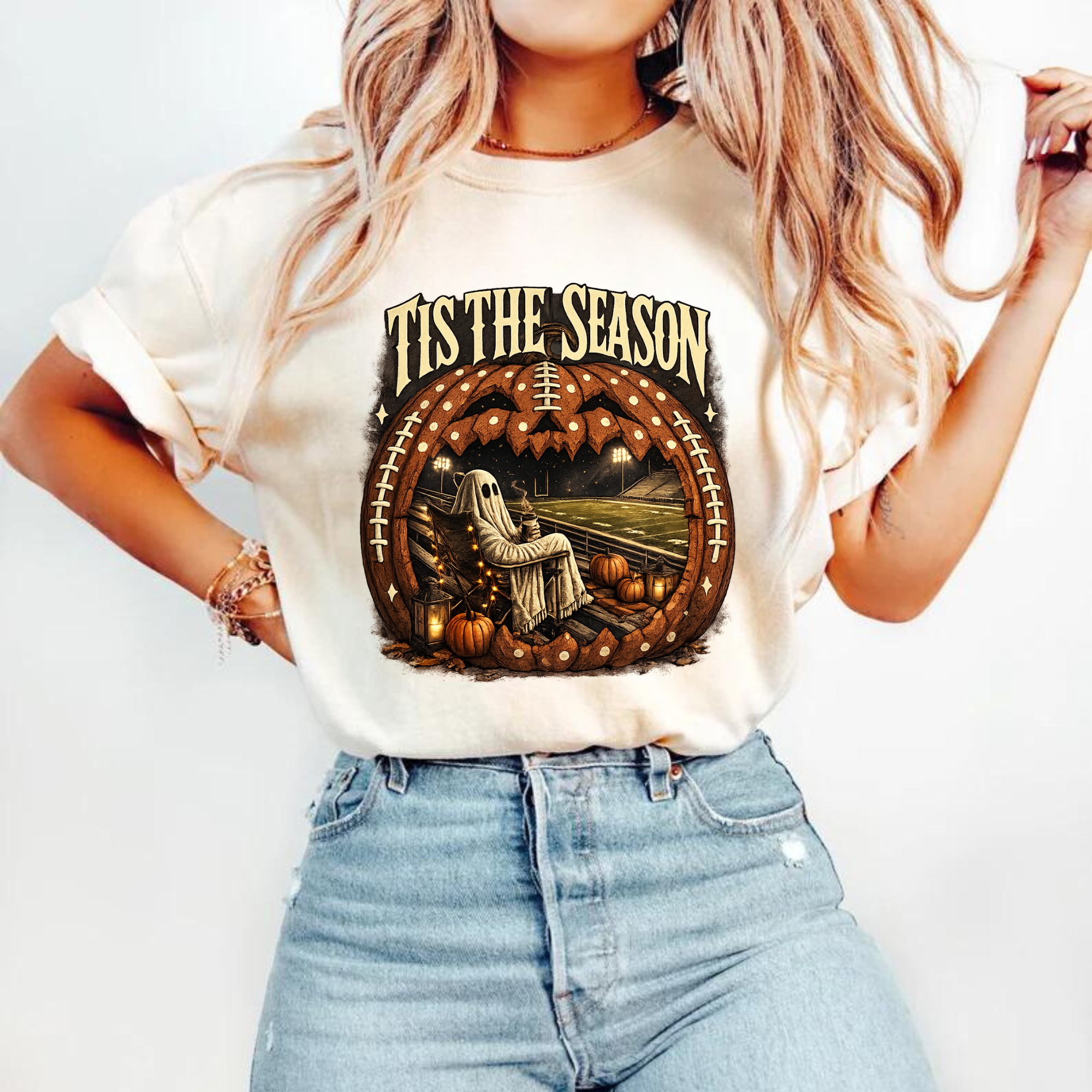 Tis the season football pumpkin ghost DTF transfer on a cream t-shirt