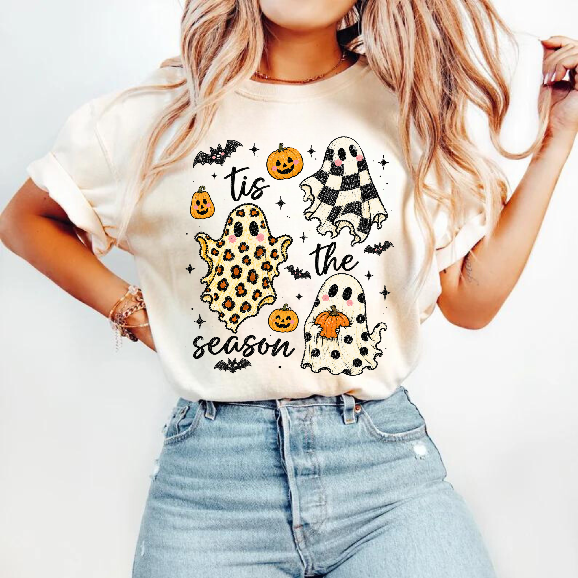 Tis the season ghosts and pumpkins DTF transfer on a cream t-shirt